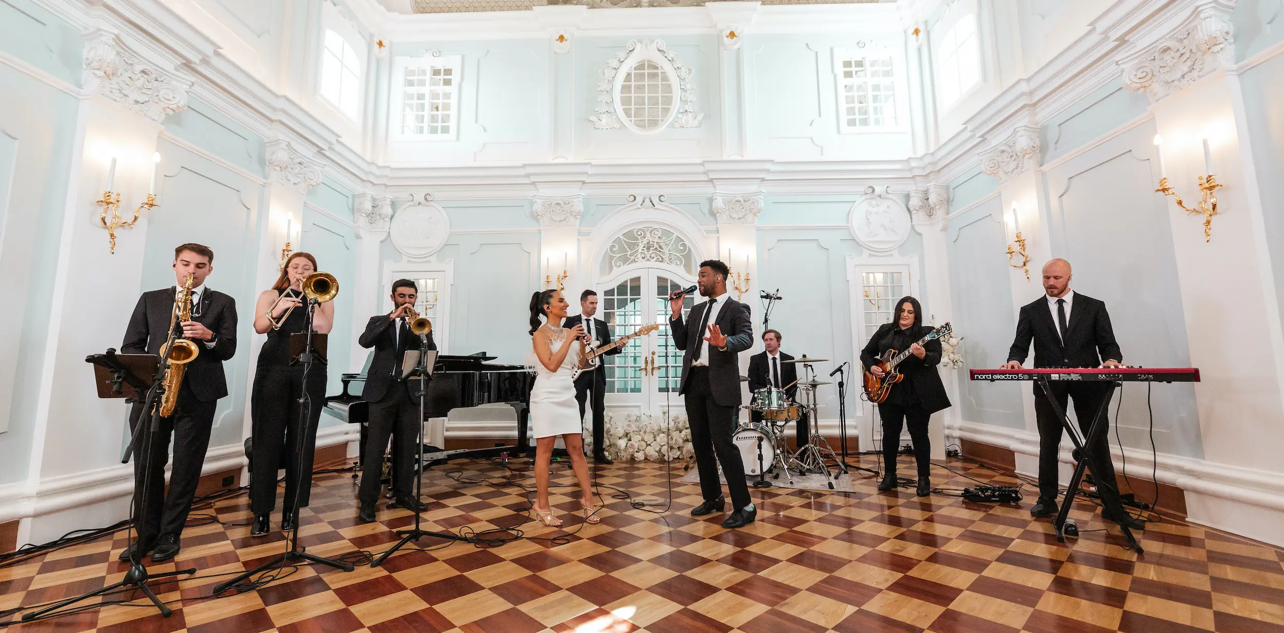 Band of musicians singing in classy hall located in Adelaide, South Australia.